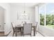 Bright dining room with a wooden table and chairs at 1736 W 166Th Ave, Broomfield, CO 80023