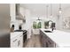 Modern kitchen with island and stainless steel appliances at 1736 W 166Th Ave, Broomfield, CO 80023