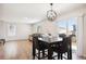 Dining area with hardwood floors and access to backyard at 1436 S Ensenada St, Aurora, CO 80017