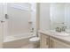 Clean bathroom with a bathtub, toilet and single sink vanity at 27255 E Alder Dr, Aurora, CO 80016