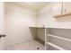 Laundry room with shelving and overhead storage at 27255 E Alder Dr, Aurora, CO 80016