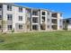 Modern apartment building with green lawn at 6153 N Ceylon St # 303, Denver, CO 80249