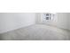 Spacious bedroom with neutral carpeting and large window at 6153 N Ceylon St # 303, Denver, CO 80249
