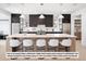 Modern kitchen with dark cabinetry, large island, and stainless steel appliances at 5061 Moss Pl, Golden, CO 80403