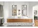 Elegant bathroom with dual sinks and modern light fixtures at 5061 Moss Pl, Golden, CO 80403