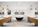 Spa-like bathroom with freestanding soaking tub and dual vanities at 5061 Moss Pl, Golden, CO 80403