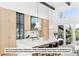 Modern kitchen with light wood cabinetry, large island, and stainless steel appliances at 5061 Moss Pl, Golden, CO 80403