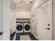 Laundry room with washer, dryer, bench, and ample cabinets at 574 Castle Pines S Dr, Castle Rock, CO 80108