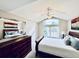 Charming bedroom with a dresser and large windows offering natural light at 574 Castle Pines S Dr, Castle Rock, CO 80108