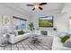 Bright living room with two sofas and a large TV at 4572 Walden Way, Denver, CO 80249