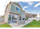 Home's backyard features a patio and grassy area at 4572 Walden Way, Denver, CO 80249