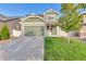 Two-story house with green accents and landscaping at 4572 Walden Way, Denver, CO 80249