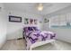 Bright bedroom with a double bed, nightstand and butterfly themed bedding at 4572 Walden Way, Denver, CO 80249