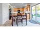 Kitchen features a breakfast nook, wood flooring, and access to a patio at 4572 Walden Way, Denver, CO 80249