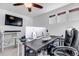 Home office featuring two desks, multiple monitors and a ceiling fan at 4572 Walden Way, Denver, CO 80249