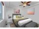 Bright bedroom with large window, ceiling fan, and neutral decor at 4572 Walden Way, Denver, CO 80249