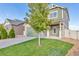 Two-story house with green accents and landscaping at 4572 Walden Way, Denver, CO 80249