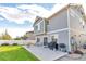 Large backyard with patio, grill, and grassy area at 4572 Walden Way, Denver, CO 80249