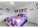 Charming bedroom featuring a white bed frame and butterfly bedding at 4572 Walden Way, Denver, CO 80249
