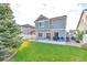 Spacious backyard with patio, grill and green lawn at 4572 Walden Way, Denver, CO 80249