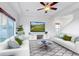Bright living room with two sofas and a large TV at 4572 Walden Way, Denver, CO 80249