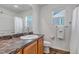 Clean bathroom with single sink vanity, shower/tub combo, and toilet at 4572 Walden Way, Denver, CO 80249