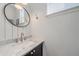 Modern bathroom with marble vanity and updated fixtures at 12939 Norway Maple St, Parker, CO 80134