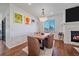 Dining area with hardwood floors, modern light fixture, and a wood dining table at 12939 Norway Maple St, Parker, CO 80134