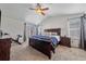 Main bedroom with king-size bed, and sliding barn door at 12939 Norway Maple St, Parker, CO 80134