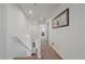 View of the upstairs hallway with carpeted flooring and access to bedrooms at 12939 Norway Maple St, Parker, CO 80134