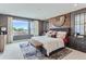 Large main bedroom with a comfortable bed and plenty of natural light at 2571 W 69Th Pl, Denver, CO 80221