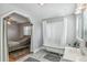 Bathroom with clawfoot tub, shower, and updated vanity at 1538 Oneida St, Denver, CO 80220