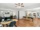 Open concept dining area with hardwood floors and kitchen views at 1538 Oneida St, Denver, CO 80220