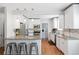 Modern kitchen with granite countertops, stainless steel appliances, and white cabinets at 1538 Oneida St, Denver, CO 80220