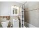 Clean bathroom with a tub/shower combo and updated vanity at 1538 Oneida St, Denver, CO 80220