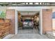 One car brick garage with shelving and workbench at 1538 Oneida St, Denver, CO 80220