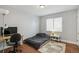 Cozy bedroom with hardwood floors and a comfortable bed at 1538 Oneida St, Denver, CO 80220
