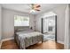 Main bedroom with hardwood floors and en-suite bathroom at 1538 Oneida St, Denver, CO 80220