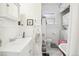 Clean bathroom with white vanity, bathtub and laundry area at 4124 Quivas St, Denver, CO 80211