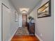 Bright entryway with hardwood floors and a console table at 1650 Fillmore St # 1006, Denver, CO 80206