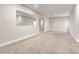 Finished basement with large mirror and open space at 102 Staghorn Way, Franktown, CO 80116