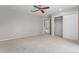 Spacious bedroom with ceiling fan and large closet at 102 Staghorn Way, Franktown, CO 80116