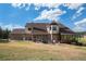 Brick house back, patio, and screened porch at 102 Staghorn Way, Franktown, CO 80116