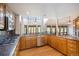 Kitchen with granite countertops, stainless steel appliances, and wood cabinets at 102 Staghorn Way, Franktown, CO 80116