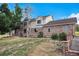 Two-story home with a brick exterior and attached garage at 102 Staghorn Way, Franktown, CO 80116
