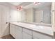 Double vanity bathroom with a large mirror at 102 Staghorn Way, Franktown, CO 80116