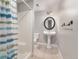 Basement bathroom with pedestal sink and shower at 102 Staghorn Way, Franktown, CO 80116