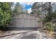 Detached garage with large double doors at 102 Staghorn Way, Franktown, CO 80116