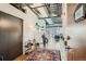 Stylish entryway with exposed ductwork, hardwood floors and unique decor at 2020 Arapahoe St # 950, Denver, CO 80205