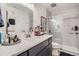 Modern bathroom with gray tile and updated vanity at 2020 Arapahoe St # 950, Denver, CO 80205